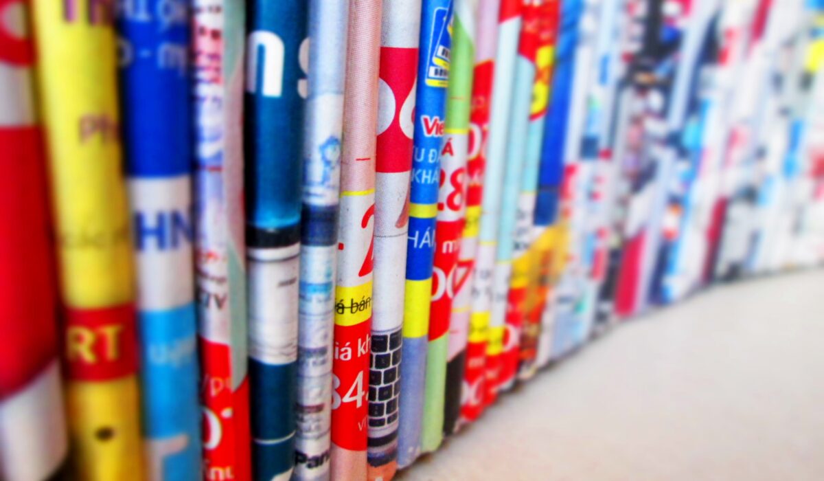 Vibrant, assorted rolled magazines create a colorful display.